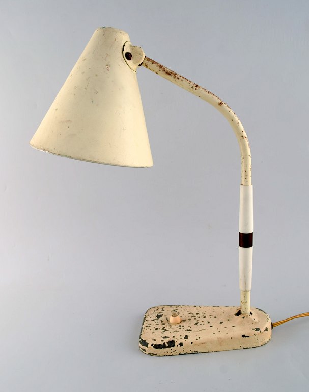 Bauhaus style. Adjustable retro table lamp in original condition with switch on 
the foot. 1950