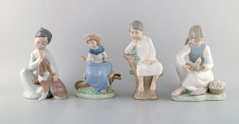 Lladro and Nao, Spain. Four porcelain figurines of children. 1980 / 90