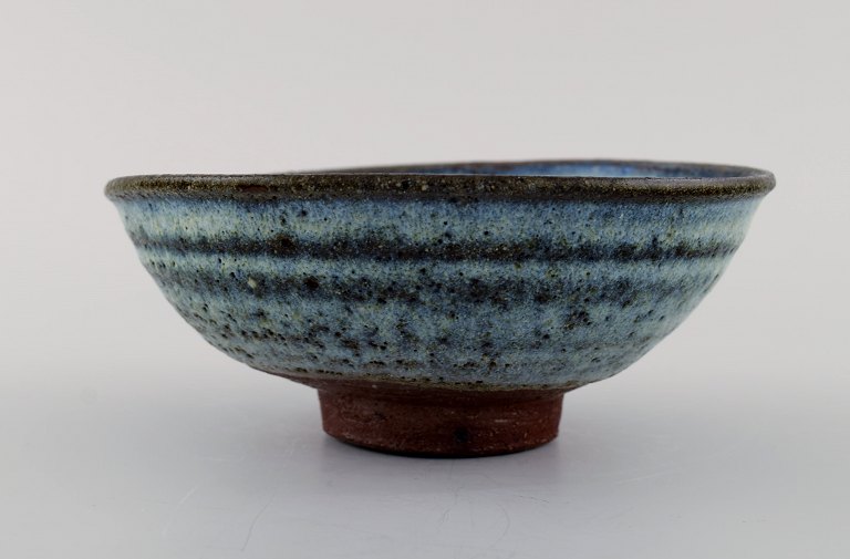 Gutte Eriksen, Denmark. Bowl on foot in glazed stoneware. Raku burnt technique. 
1960