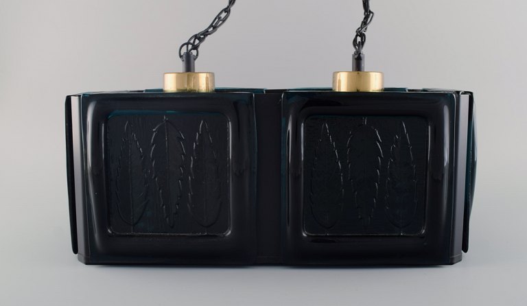 Swedish design. Ceiling lamp in black lacquered metal and mouth-blown art glass 
with leaves in relief. 1960s / 70s.
