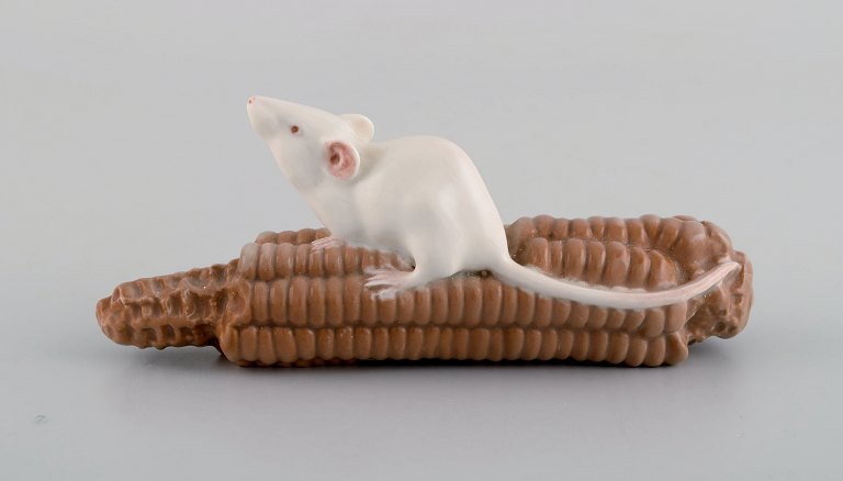 Royal Copenhagen porcelain figurine. Mouse on corn cob. Early 20th century. 
Model number 512.
