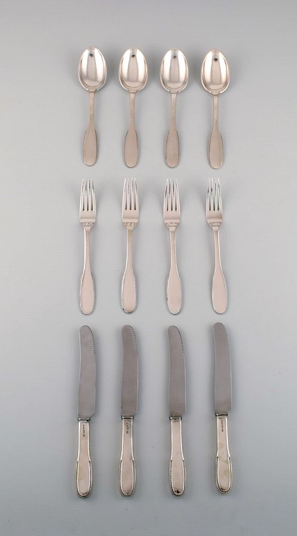 Evald Nielsen number 14 dinner service in hammered silver (830) for four people. 
1920s.
