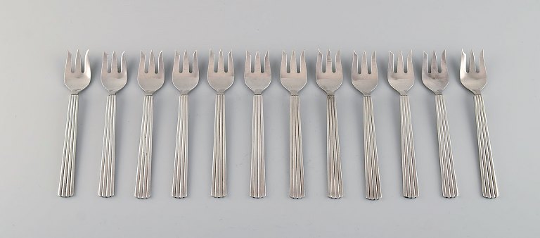 Sigvard Bernadotte for Georg Jensen. Twelve Bernadotte cake forks in sterling 
silver.
