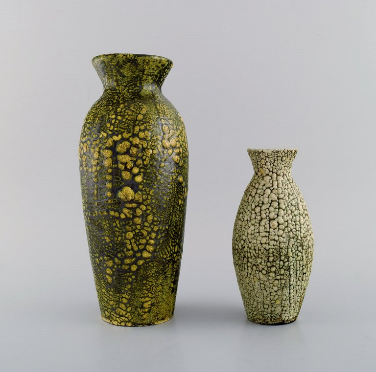 European studio ceramicist. Two vases in glazed ceramics. Beautiful glaze in 
green and yellow shades. 1960s / 70s.
