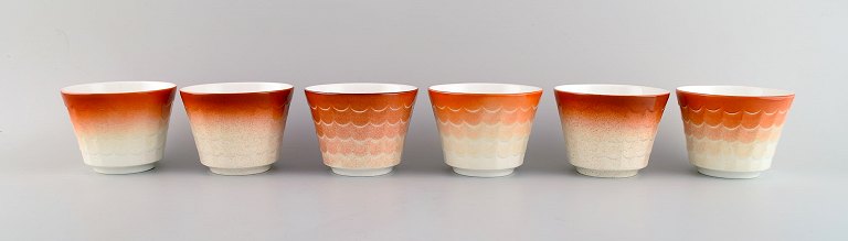 Wilhelm Kåge for Gustavsberg. Six flower pot covers in porcelain. Swedish 
design, 1960s.
