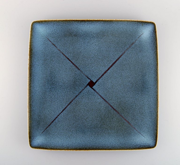 Inger Persson (b. 1936) for Rörstrand. Large square dish in glazed ceramics. 
Swedish design. Dated 1989.
