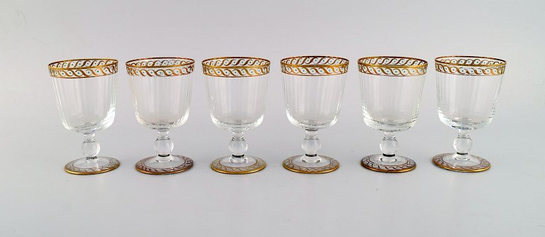 Nason & Moretti, Murano. Six white wine glasses in mouth-blown art glass with 
hand-painted turquoise and gold decoration. 1930s.
