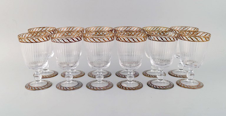 Nason & Moretti, Murano. Twelve water glasses in mouth-blown art glass with 
hand-painted turquoise and gold decoration. 1930s.
