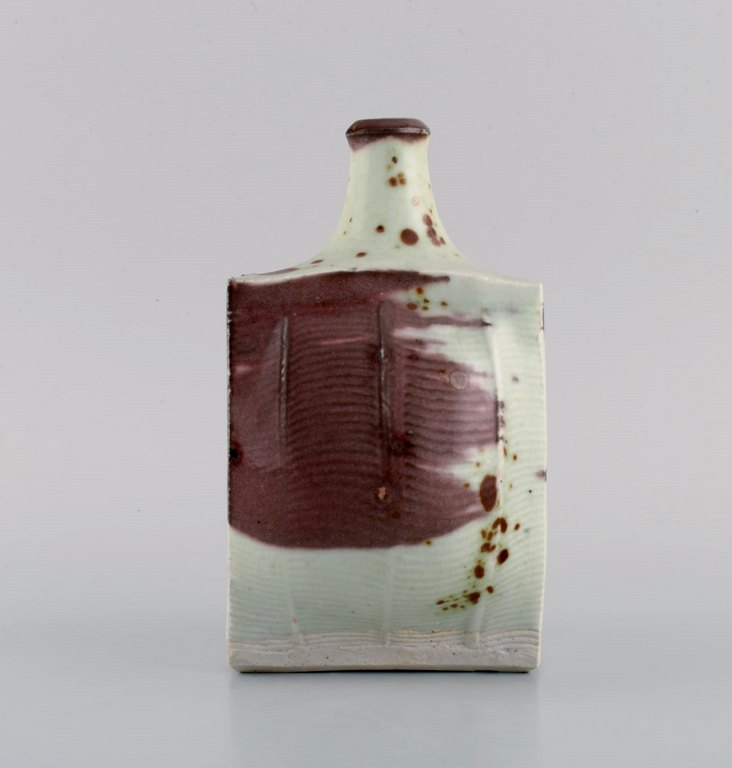 European studio ceramicist. Vase in glazed ceramics. Beautiful glaze in purple 
and pastel shades. Late 20th century.
