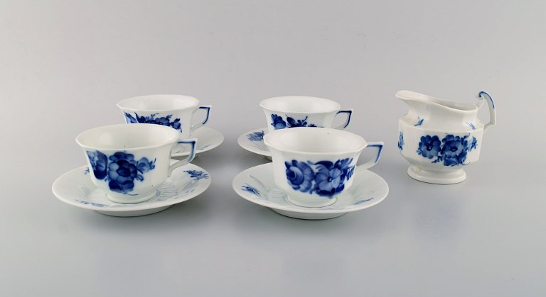 Four Royal Copenhagen Blue Flower Angular coffee cups with saucers and creamer. 
1960s.

