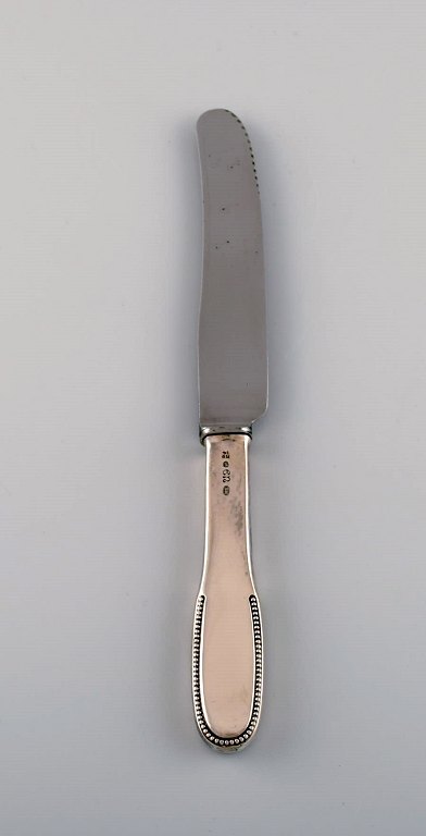 Evald Nielsen number 14 dinner knife in hammered silver (830) and stainless 
steel. 1920s. Two pcs in stock. 
