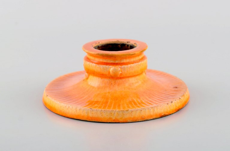 Svend Hammershøi for Kähler, Denmark. Candle holder in glazed stoneware. 
Beautiful yellow uranium glaze. 1930s / 40s.
