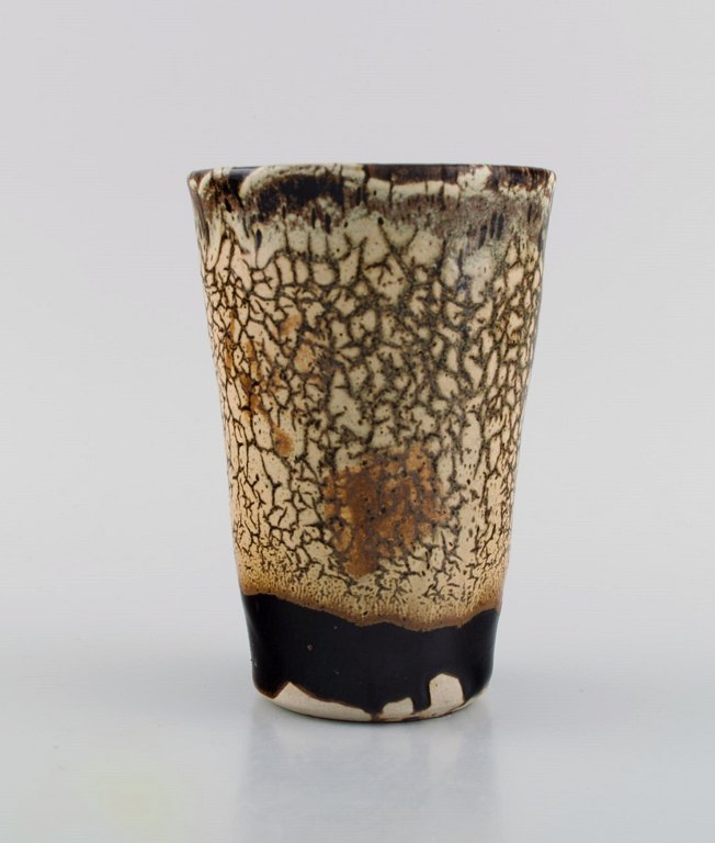 Isabelle Dacourt, France. Unique vase in glazed stoneware. Beautiful crackled 
glaze in cream and dark shades. Late 20th century.
