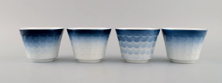 Wilhelm Kåge for Gustavsberg. Four flower pot covers in porcelain. Swedish 
design, 1960s.
