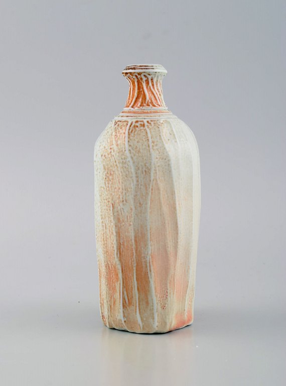 Danish studio ceramicist. Unique vase in glazed stoneware. Beautiful glaze in 
light and orange shades. Late 20th century.
