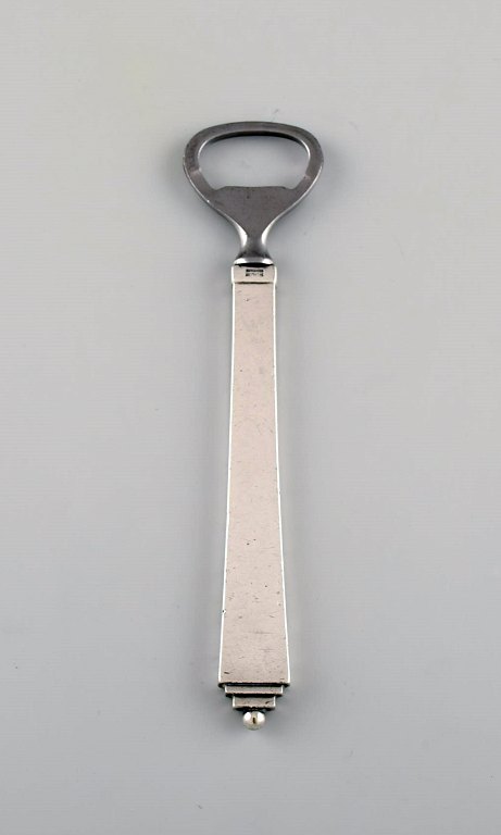 Georg Jensen Pyramid bottle opener in sterling silver and stainless steel. Dated 
1933-44.
