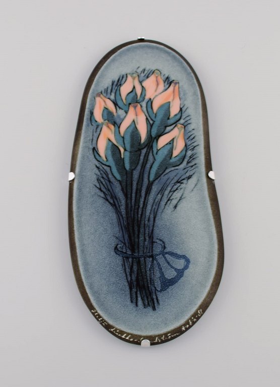 Heljä Liukko-Sundström (b. 1938) for Arabia. Glazed faience wall plaque with 
hand-painted flowers. Finnish design. Dated 1981.
