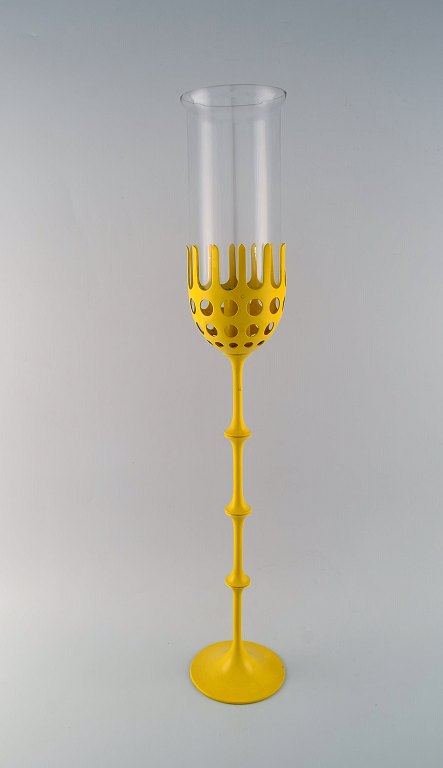 Bjørn Wiinblad (1918-2006). Large Hurricane candlestick in yellow lacquered 
metal with blue tinted glass. 1970s / 80s.
