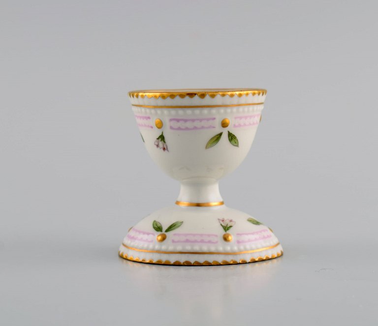 Royal Copenhagen Flora Danica egg cup in hand-painted porcelain with flowers and 
gold decoration. Model number 20/3530.
