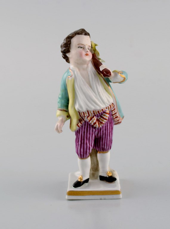 Augustus Rex, Tyskland. Antik håndmalet porcelænsfigur. Dreng med vadsæk. 
1800-tallet.
