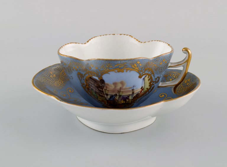 Helene Wolfson for Dresden. Antique coffee cup with saucer in hand-painted 
porcelain with merchants and gold decoration. Approx. 1860.
