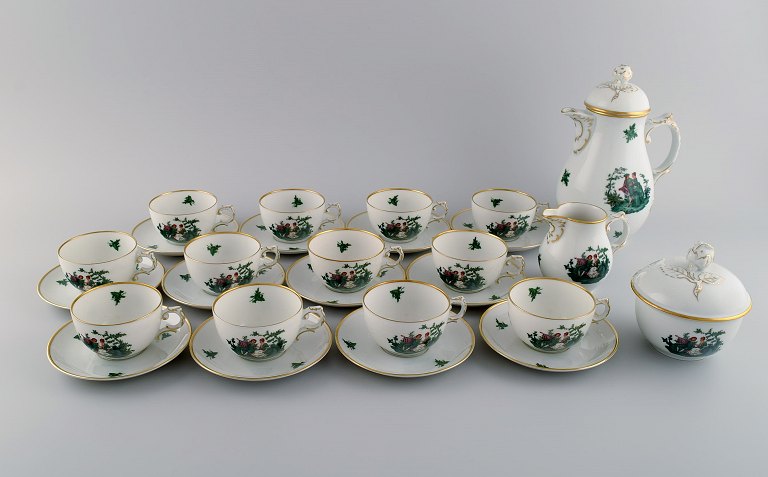 Fürstenberg, Germany. Porcelain coffee service for twelve people. Romantic 
scenes and gold decoration. 1920s.
