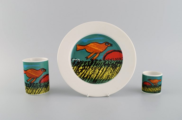 Corneille (Guillaume Cornelis van Beverloo), Dutch CoBrA artist (1922-2010). 
Coffee cup, plate and egg cup in porcelain decorated with birds over field with 
sunrise. 1980s / 90s.
