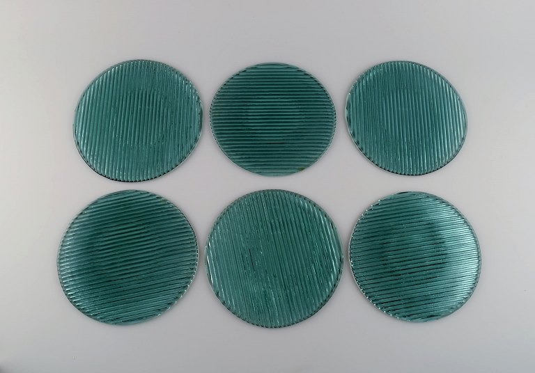 Per Lütken for Holmegaard. Six "Buffet" plates in blue-green mouth blown art 
glass. 1980s.
