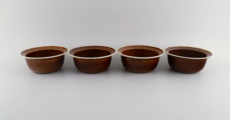 Stig Lindberg for Gustavsberg. Four Coq bowls in glazed stoneware. Beautiful 
glaze in brown shades. Swedish design, 1960s.
