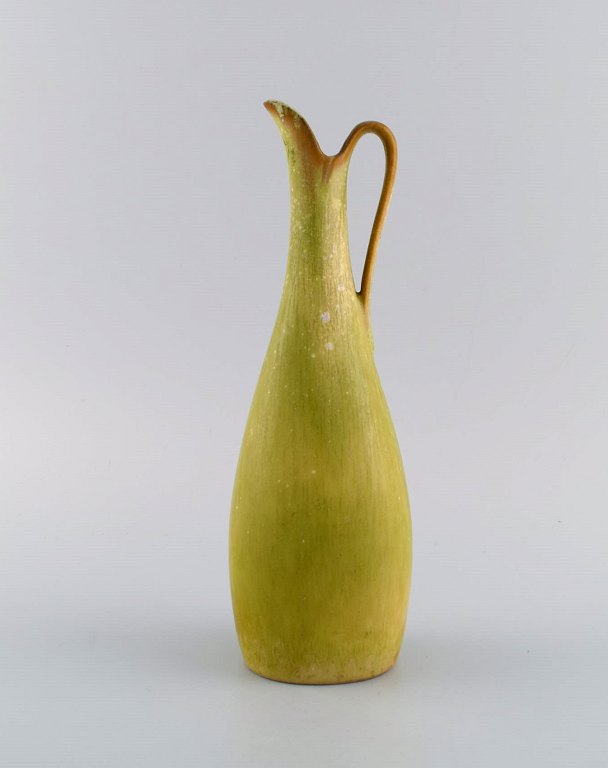 Gunnar Nylund (1904-1997) for Rörstrand. Pitcher in glazed ceramics. Beautiful 
eggshell glaze in light lime shades. Mid-20th century.
