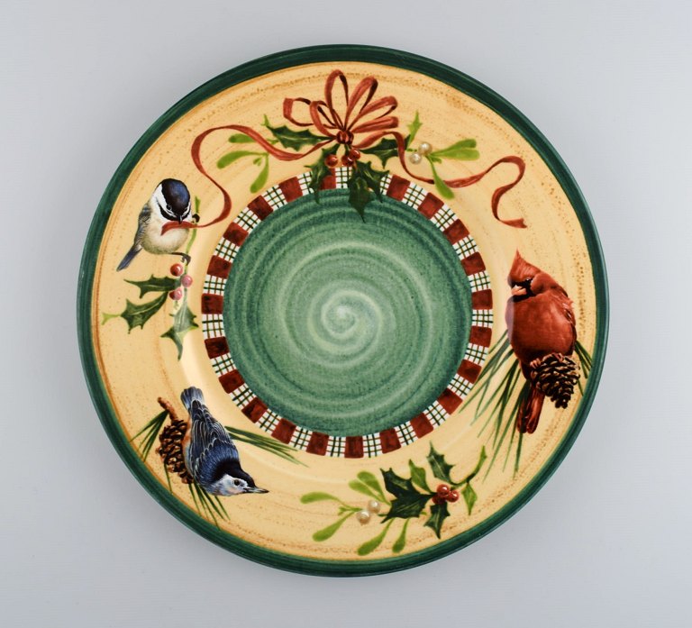 Catherine McClung for Lenox. "Winter greetings". Large round dish in glazed 
stoneware decorated with mistletoe, birds and red ribbon. Approx. 2000.
