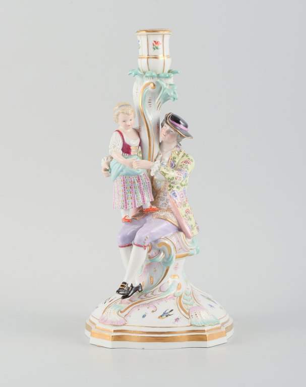 Large antique Meissen candlestick in hand-painted porcelain decorated with 
flowers, insects and birds. Man and girl.
19th century.