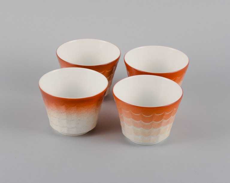 Wilhelm Kåge for Gustavsberg. Four flower pot covers in porcelain. Swedish 
design, 1960s.