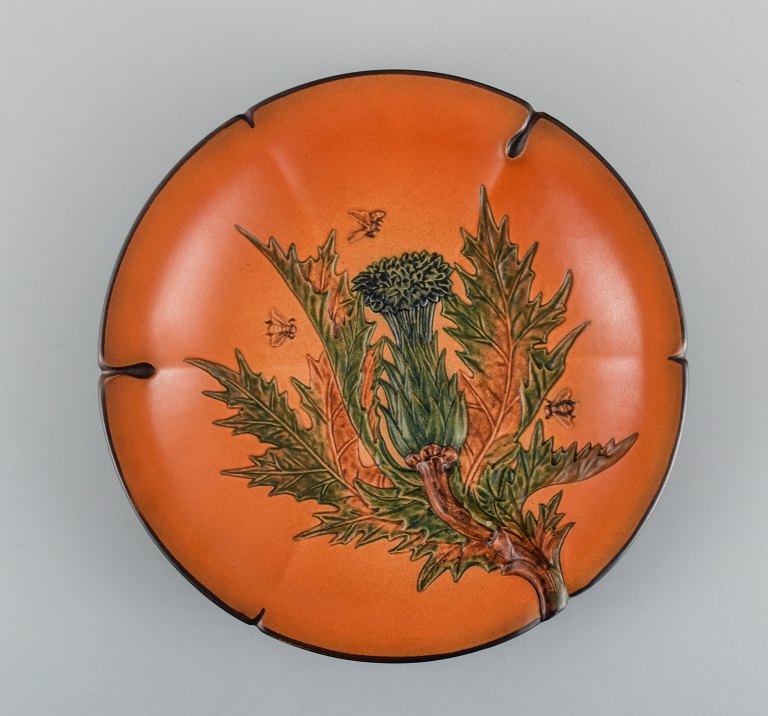 Ipsens, Denmark. Hand-painted glazed ceramic dish with flower and bees.
1920s.
