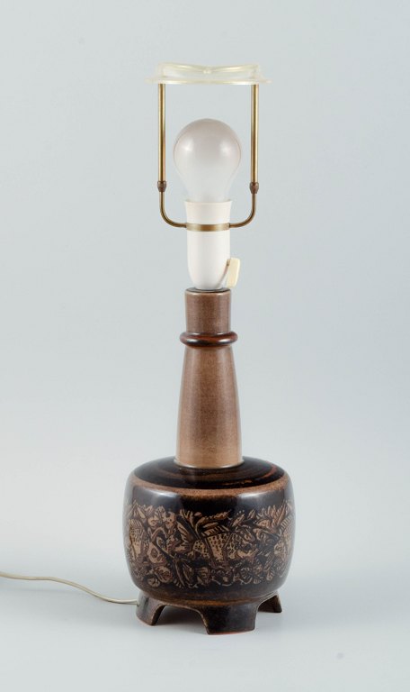 Nils Thorsson, b. Eslöv (1898-1975). 
Royal Copenhagen porcelain table lamp mounted on four feet.