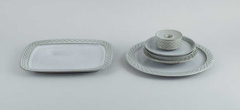 Jens H. Quistgaard (1919-2008) for Bing & Grøndahl / Nissen Kronjyden. Six parts gray "Cordial" consisting ofA round dish, an oval dish, a small deep plate, two side plates and a candlestick.