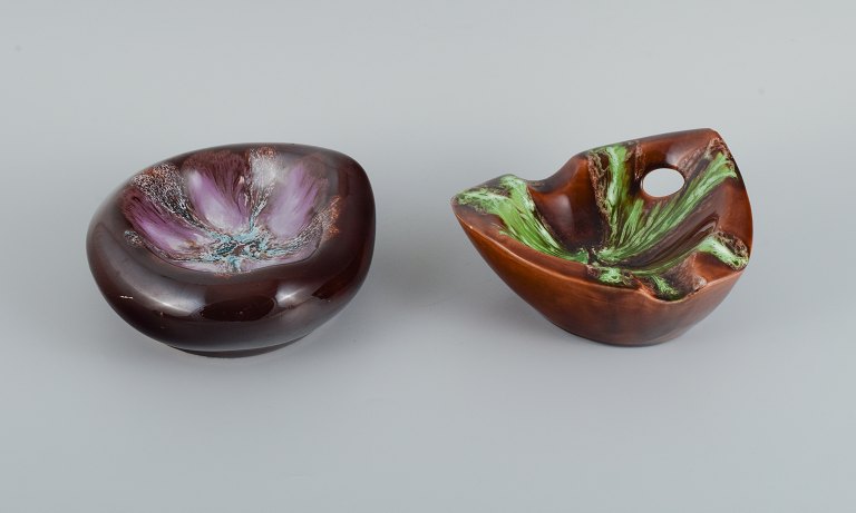 Vallauris, France, two ceramic bowls in brightly colored glazes.