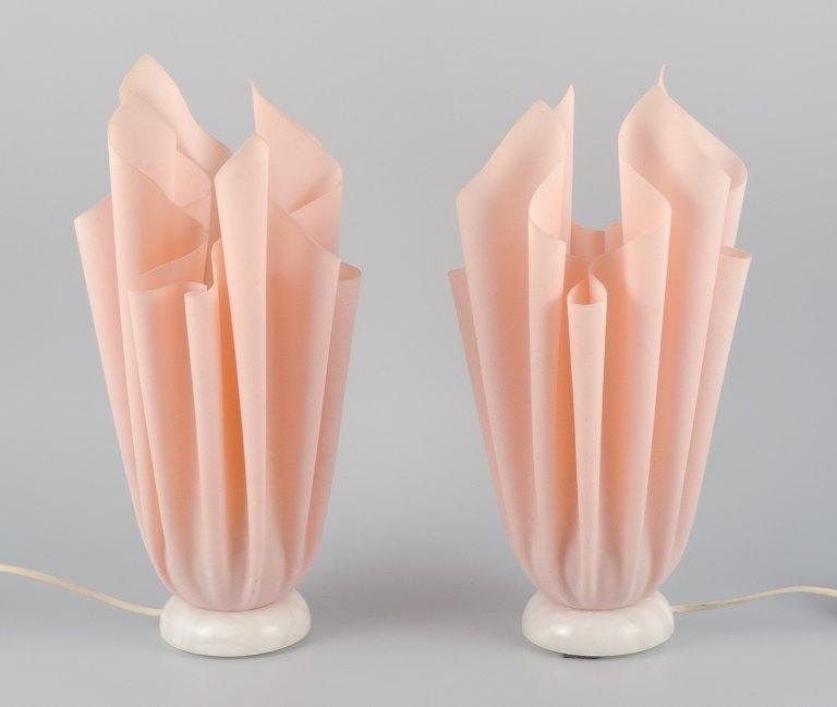Georgia Jacobs, French designer, a pair of rose-coloured table lamps in resin on 
a marble base.