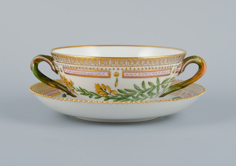 Royal Copenhagen Flora Danica boullion cup with saucer in hand-painted porcelain 
with branch-shaped handles, flowers and gold decoration. 
PROVENANCE : VALDEMARS CASTLE