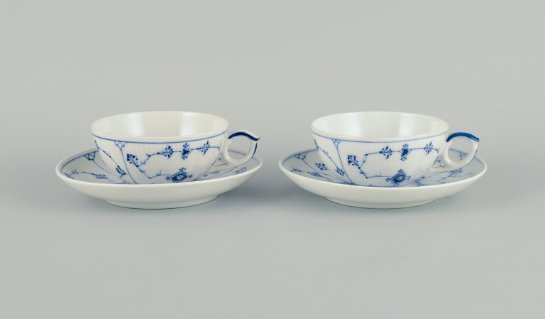 Two sets of Royal Copenhagen Blue Fluted Plain tea cups and saucers in hand 
painted porcelain.