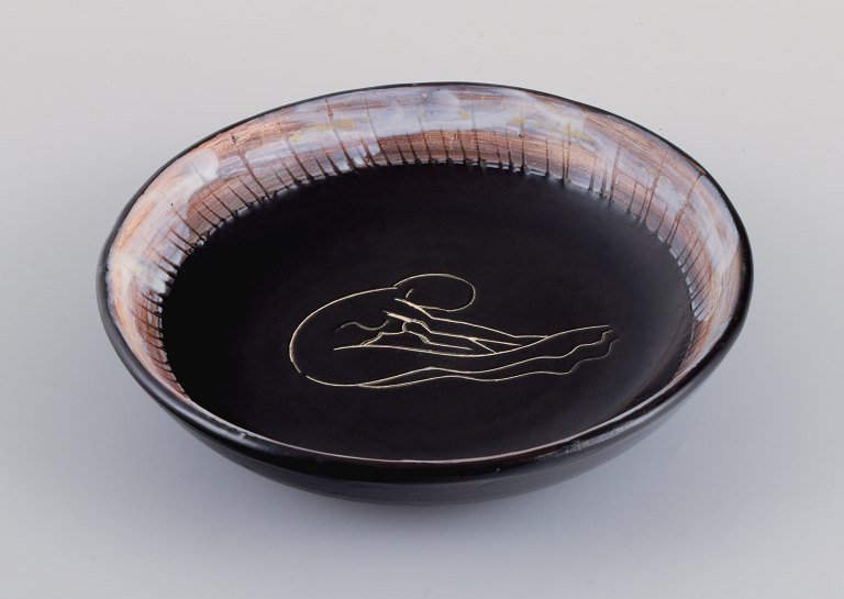 Vallauris, France, unique ceramic bowl in black glaze with female motif.