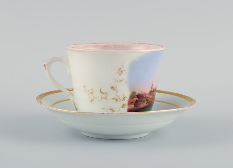 Antik KPM, Berlin, cup in overglaze, hand painted with city motif from Leere in 
Germany.