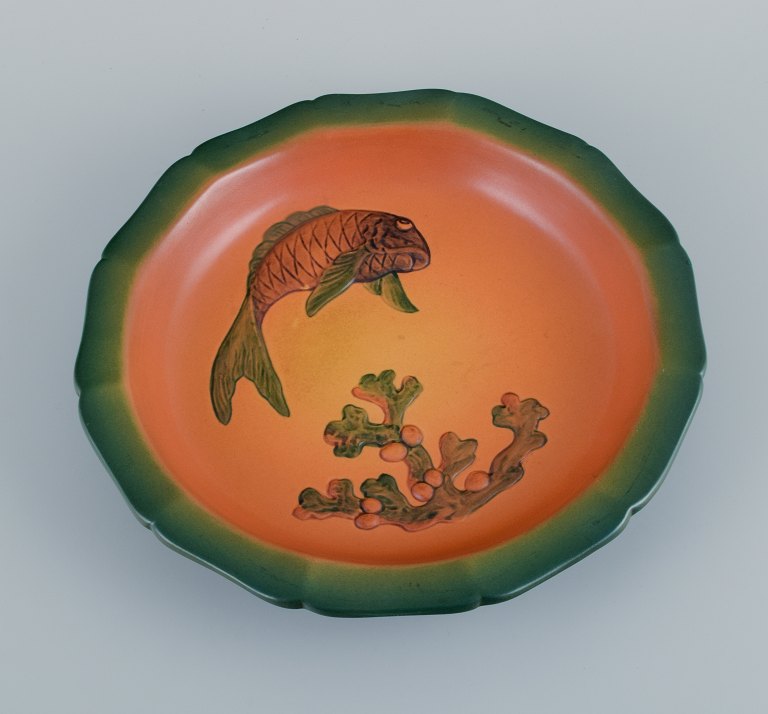 Ipsens, Denmark, dish with fish with glaze in orange-green shades.