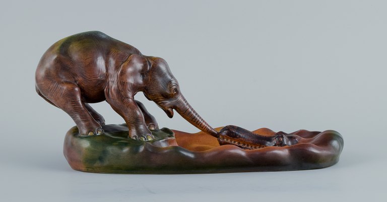 Ipsens, Denmark, Elephant and Crocodile. Ceramic figure, glaze in orange-green 
shades.