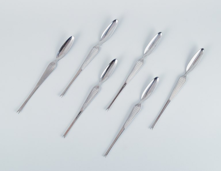 KAJ FRANCK "SCANDIA" for Hackman, Finland, set of six stainless steel seafood 
cutlery.