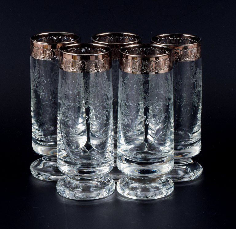 Murano, Italy, five mouth-blown and engraved drinking glasses with silver rim.