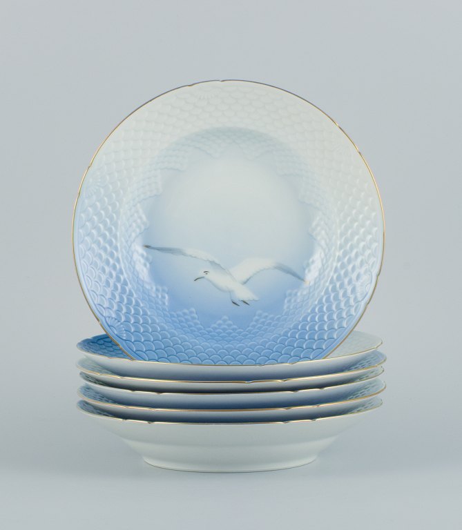 Bing & Grøndahl Seagull, six deep plates with seagull and gold decoration.