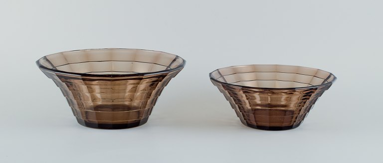 Simon Gate (1883-1945) for Orrefors/Sandvik, Sweden.
Two large Art Deco bowls in smoked coloured pressed glass.