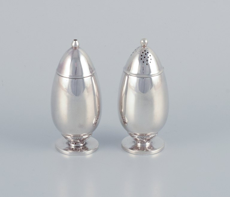 Gundorph Albertus (1887-1970) for Georg Jensen, Denmark, "Cactus" salt and 
pepper shakers in sterling silver.