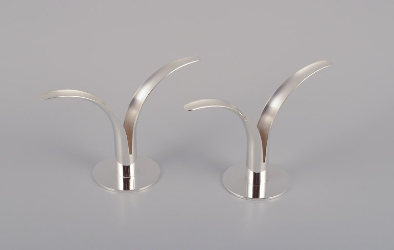 Ivar Ålenius Björk (1905-1978), Ystad Metall.
A pair of "Liljan" (Lilly) candle holders in plated silver. Swedish design 
classic